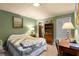Cozy bedroom with green walls, carpet and a warm, inviting decor at 2355 Ewing Ne Dr, Brookhaven, GA 30319