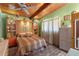 Cozy bedroom with wood-beamed ceilings, built-in shelving, and warm lighting at 2355 Ewing Ne Dr, Brookhaven, GA 30319