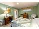 Comfortable bedroom featuring a bed, desk, and neutral-colored carpeting at 2355 Ewing Ne Dr, Brookhaven, GA 30319