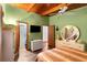 Comfortable bedroom featuring wood-beamed ceilings, hardwood floors, and plenty of natural light at 2355 Ewing Ne Dr, Brookhaven, GA 30319