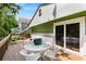 Home's spacious deck with white furniture and doors into the home at 2355 Ewing Ne Dr, Brookhaven, GA 30319