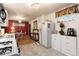 Practical kitchen featuring white cabinets, vinyl flooring and a breakfast nook at 2355 Ewing Ne Dr, Brookhaven, GA 30319