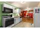 Functional kitchen with white cabinetry and standard appliances offering a cozy eating space at 2355 Ewing Ne Dr, Brookhaven, GA 30319