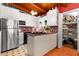 Well-lit kitchen featuring a stainless steel fridge, gas cooktop, and pantry at 2355 Ewing Ne Dr, Brookhaven, GA 30319
