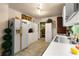 Kitchen featuring white appliances, tiled flooring, and a view of adjacent room at 2355 Ewing Ne Dr, Brookhaven, GA 30319