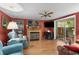 Comfortable living room with decorative fireplace and access to sunroom at 2355 Ewing Ne Dr, Brookhaven, GA 30319