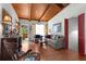 Cozy living room featuring hardwood floors, beamed ceilings and lots of natural light at 2355 Ewing Ne Dr, Brookhaven, GA 30319
