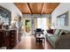 Bright living room with a wood ceiling, hardwood floors, and natural light at 2355 Ewing Ne Dr, Brookhaven, GA 30319