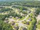Aerial view of residential neighborhood with mature trees and well-maintained landscaping at 3202 Lucky Pl, Conyers, GA 30013