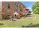 A beautiful brick two-story house overlooking a spacious backyard with a patio set at 3202 Lucky Pl, Conyers, GA 30013