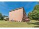 A beautiful brick two-story house overlooking a spacious backyard with a patio set at 3202 Lucky Pl, Conyers, GA 30013