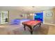 Finished basement with billiards area, wet bar, and media room perfect for entertaining guests at 3202 Lucky Pl, Conyers, GA 30013
