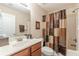 Bathroom boasting a large vanity, modern faucet, and a shower and tub combo at 3202 Lucky Pl, Conyers, GA 30013