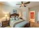 Cozy bedroom with ensuite bathroom and decorative ceiling fan at 3202 Lucky Pl, Conyers, GA 30013