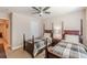 Bedroom featuring two beds with wooden frames and matching plaid comforters at 3202 Lucky Pl, Conyers, GA 30013