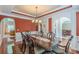 Well-appointed dining room featuring a wooden table, chandelier, and seamless flow to living areas at 3202 Lucky Pl, Conyers, GA 30013