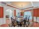 Dining room with a large table, chandelier, and view into the adjacent living area at 3202 Lucky Pl, Conyers, GA 30013
