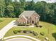 Stately two-story brick home with manicured lawn and inviting front entrance at 3202 Lucky Pl, Conyers, GA 30013