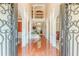 Grand foyer with gleaming hardwood floors, arched entryways, and view of the staircase and living area at 3202 Lucky Pl, Conyers, GA 30013