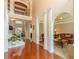 Spacious foyer featuring hardwood floors, elegant columns, staircase and view of the upper level at 3202 Lucky Pl, Conyers, GA 30013