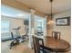 Basement gym/dining area with workout equipment, decorative lighting, and neutral tones at 3202 Lucky Pl, Conyers, GA 30013