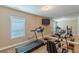 Basement gym featuring a mirrored wall, treadmill, and exercise bike at 3202 Lucky Pl, Conyers, GA 30013