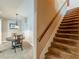 Entryway featuring a wooden staircase and a dining area with chandelier lighting at 3202 Lucky Pl, Conyers, GA 30013