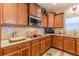 Well-equipped kitchen boasting granite countertops, custom cabinets, and modern appliances at 3202 Lucky Pl, Conyers, GA 30013