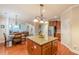Open kitchen layout flows into the dining area, showcasing an island and stainless appliances at 3202 Lucky Pl, Conyers, GA 30013