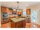 Gourmet kitchen with granite countertops, stainless steel appliances, and ample cabinet space at 3202 Lucky Pl, Conyers, GA 30013