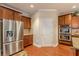 Modern kitchen featuring a stainless steel refrigerator, double oven, and granite counters at 3202 Lucky Pl, Conyers, GA 30013