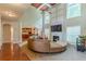 Inviting living room showcasing a fireplace, tv, large windows, and comfortable seating at 3202 Lucky Pl, Conyers, GA 30013