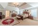Expansive main bedroom featuring a trey ceiling and sitting area, providing a luxurious retreat at 3202 Lucky Pl, Conyers, GA 30013