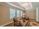 Sitting area in the expansive main bedroom features a trey ceiling and comfortable furnishings at 3202 Lucky Pl, Conyers, GA 30013