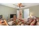 Sitting area with brown leather sofa, colorful rug, and access to another room; a comfortable and inviting space at 3202 Lucky Pl, Conyers, GA 30013