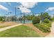 Well-lit community tennis court offers a great recreational amenity for residents at 3202 Lucky Pl, Conyers, GA 30013