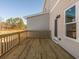 Picture of a wood deck featuring light colored wood and a railing, with a house wall on the right at 1979 Deco Dr, Kennesaw, GA 30144