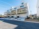 Street view of new townhomes, featuring garages and balconies at 1979 Deco Dr, Kennesaw, GA 30144