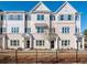 Beautiful townhomes featuring a brick exterior and classic architectural design at 1979 Deco Dr, Kennesaw, GA 30144