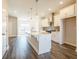 Bright kitchen featuring a large kitchen island, stainless steel appliances, and modern pendant lighting at 1979 Deco Dr, Kennesaw, GA 30144
