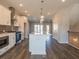Bright kitchen featuring a large island, stainless steel appliances, and wood flooring at 1979 Deco Dr, Kennesaw, GA 30144