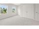 Bright bedroom with two windows and large closet providing ample natural light and storage at 2529 Brown Dove Way (Lot 80), Grayson, GA 30017