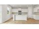 Bright, open kitchen with a center island and stainless steel appliances at 2529 Brown Dove Way (Lot 80), Grayson, GA 30017