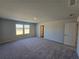 Bright bedroom with neutral walls, plush carpet, and double window views to the backyard at 2539 Brown Dove Way(Lot 81), Grayson, GA 30017