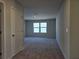 Spacious carpeted bedroom with two windows allowing plenty of natural light at 2539 Brown Dove Way(Lot 81), Grayson, GA 30017
