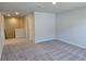 Neutral-toned loft with patterned carpet and natural lighting at 2539 Brown Dove Way(Lot 81), Grayson, GA 30017