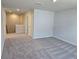 Open loft area featuring neutral walls, carpet, and recessed lighting at 2539 Brown Dove Way(Lot 81), Grayson, GA 30017