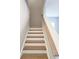 Staircase with hardwood steps and a wooden handrail leading upstairs at 2539 Brown Dove Way(Lot 81), Grayson, GA 30017