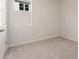 Cozy bedroom with plush gray carpeting, a window for natural light, and a closet at 2519 Brown Dove Way (Lot 79), Grayson, GA 30017