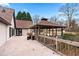 Backyard deck with gazebo, wooden railing, and outdoor seating area perfect for entertaining at 3355 Old Peachtree Rd, Dacula, GA 30019